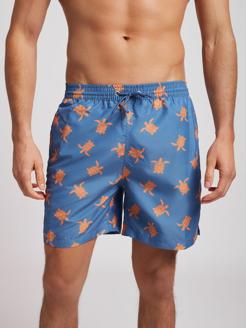 Classic blue swim shorts printed with turtles