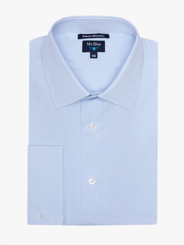 Camisa azul claro de mil rayas con botón en el puño
